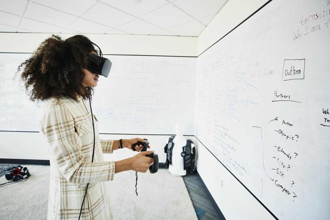 Pictured: A student interacts with a virtual reality system. | Getty Images
